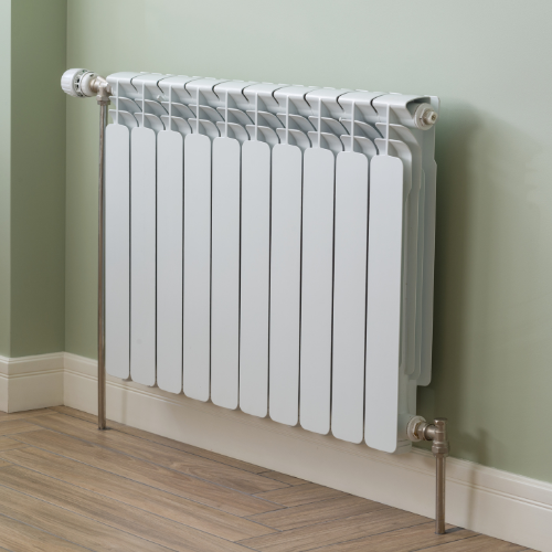 Jack The Plumber technician inspecting a radiator for heating repairs in Birmingham.