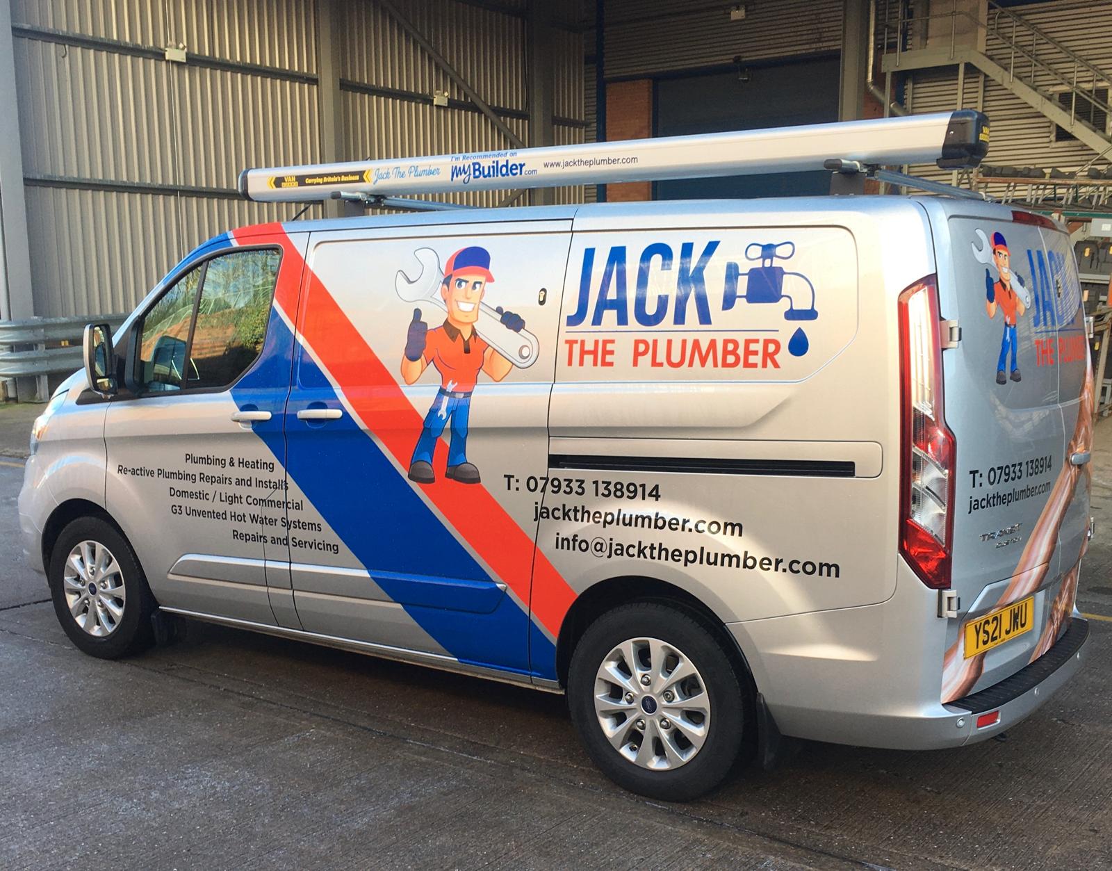 Professional plumber from Jack The Plumber Ltd. fixing a leak in a residential kitchen.